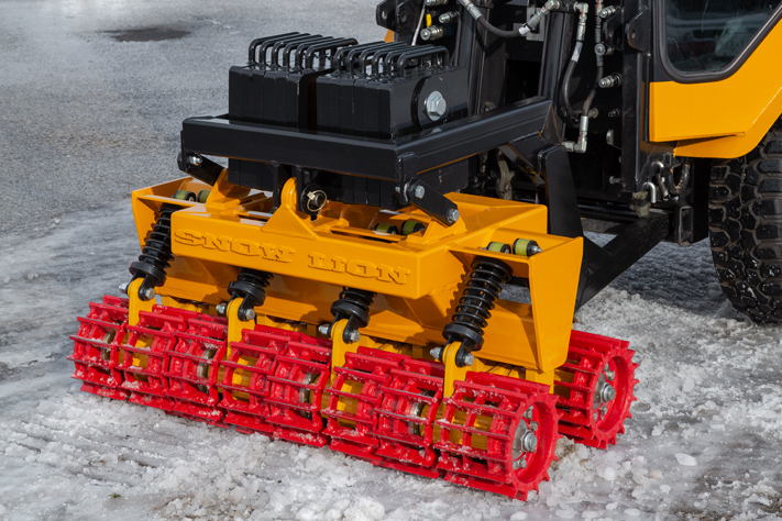 trackless vehicles snow lion ice-breaker on sidewalk tractor front view close-up