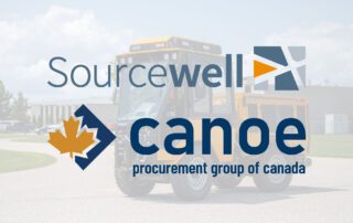 Sourcewell and Canoe logos overlayed on an image of a Trackless MT7 in front of the Trackless Vehicles plant