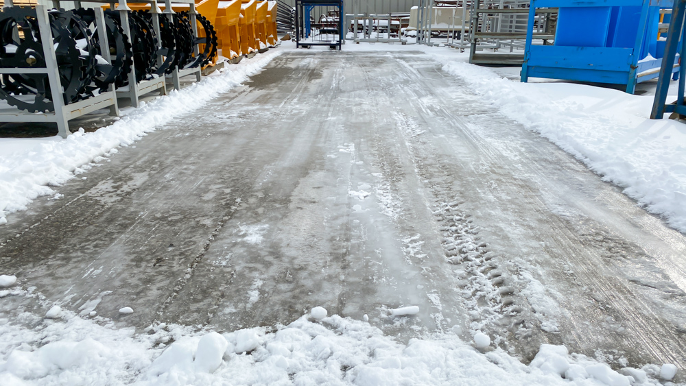 snow on ground before trackless vehicles 5-position folding v-plow attachment on sidewalk tractor