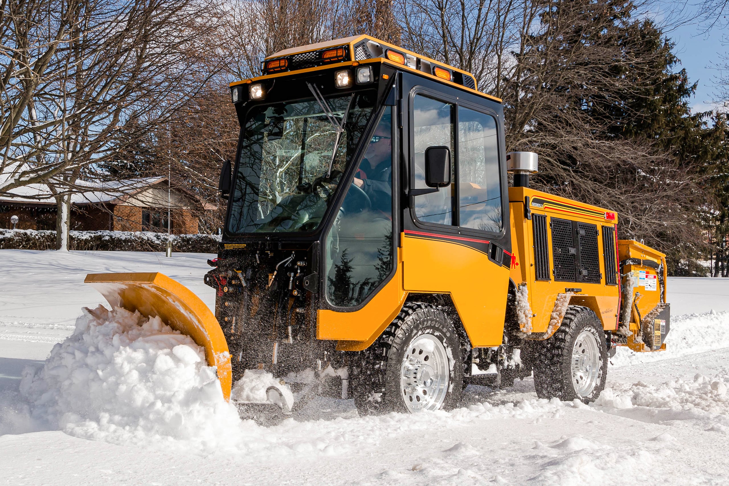 trackless vehicles double trip plow attachment on sidewalk municipal tractor