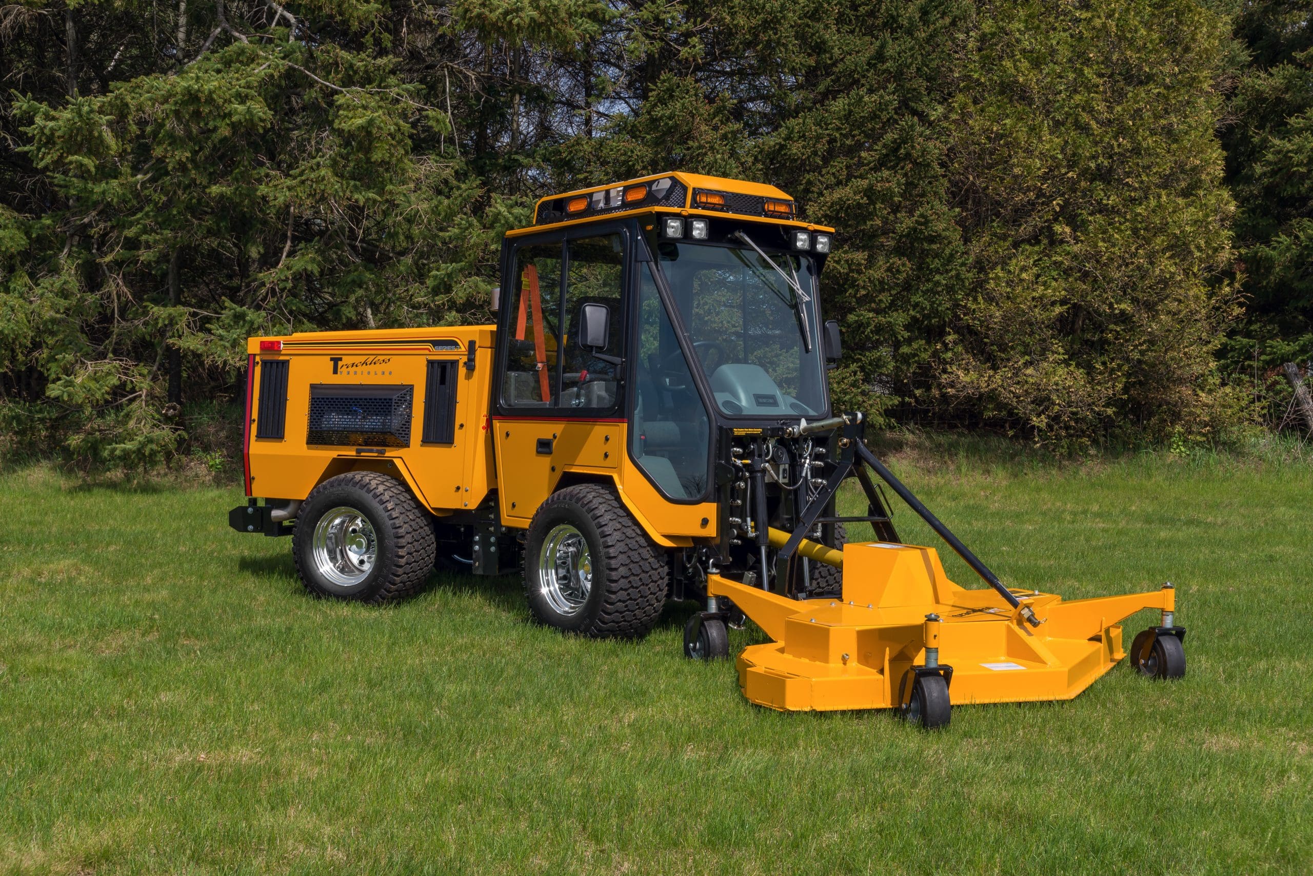 trackless vehicles rotary finishing mower 6' attachment on sidewalk municipal tractor