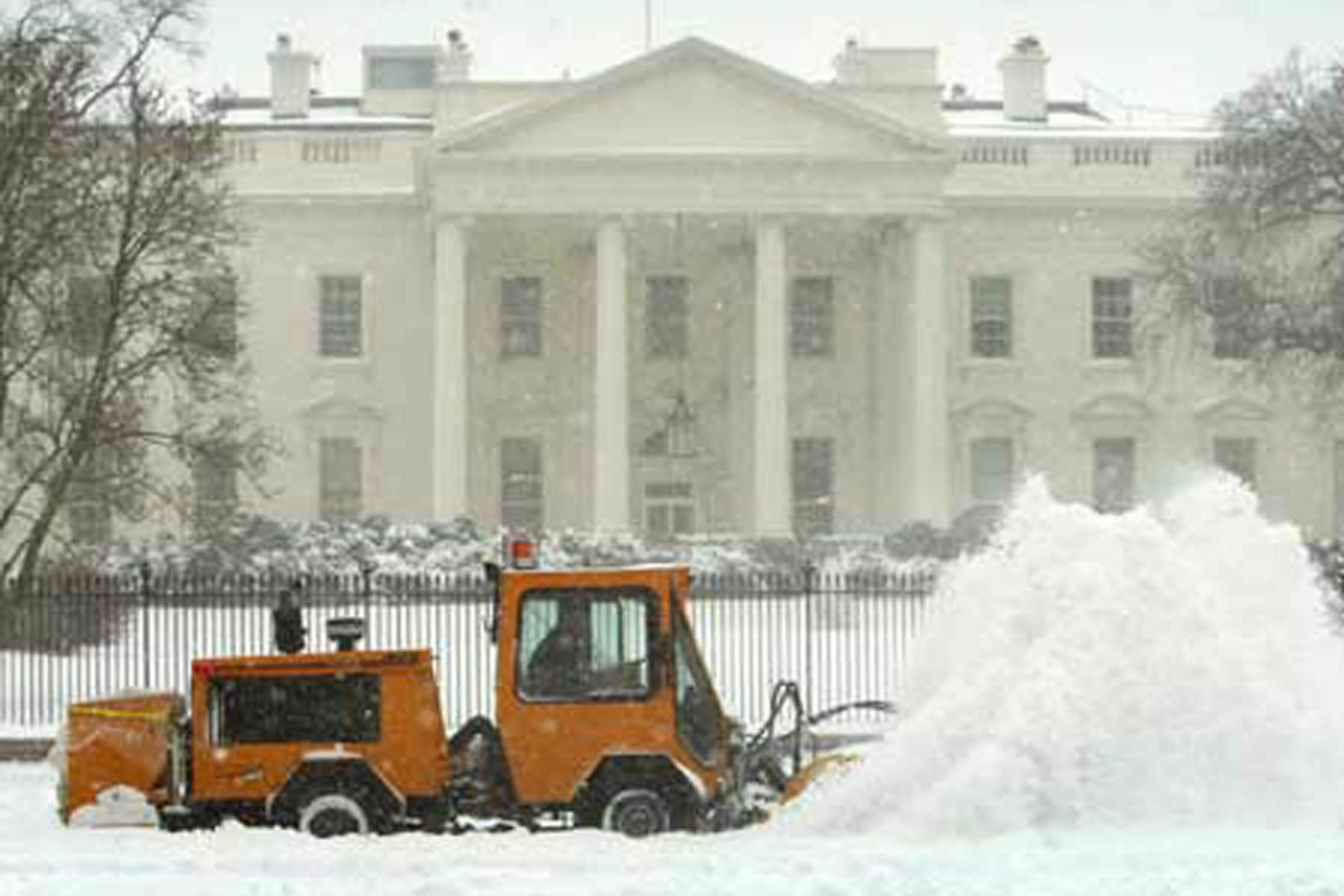 trackless vehicles mt5 tractor machine and power angle sweeper sweeping snow in front of the white house