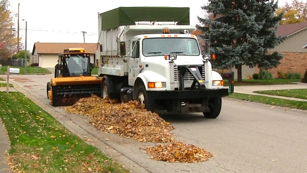 snow on ground before trackless vehicles 5-position folding v-plow attachment on sidewalk tractor